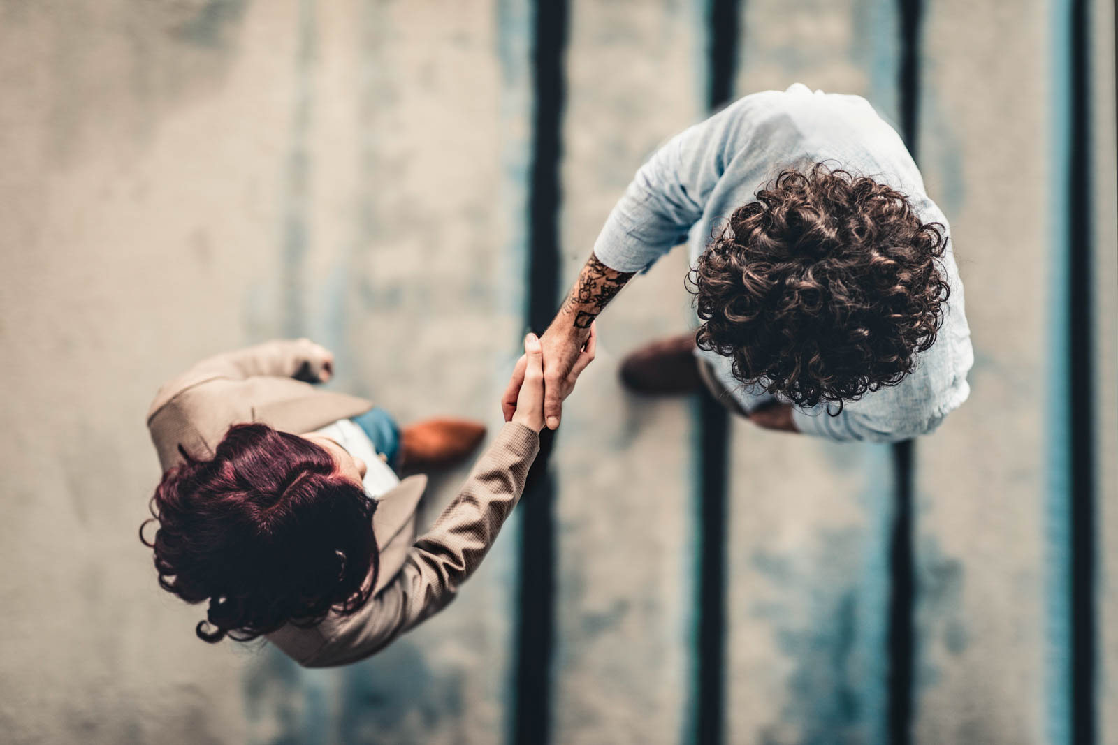 overhead view of two people shaking hands